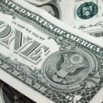 Detailed macro shot of a United States one dollar bill showing various design elements.